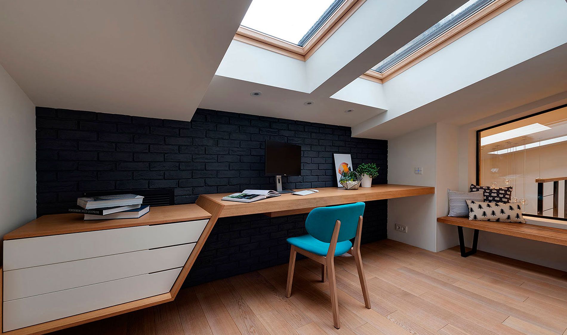 Architectural interior with large skylights and tailored window openings