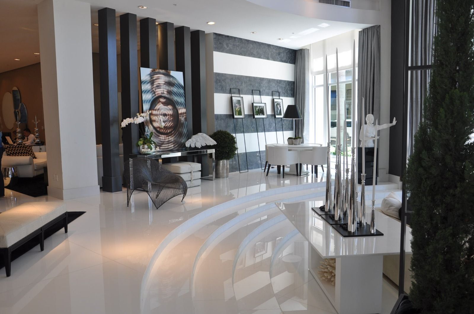 Display hall with dark vertical panelling and lit vitrines