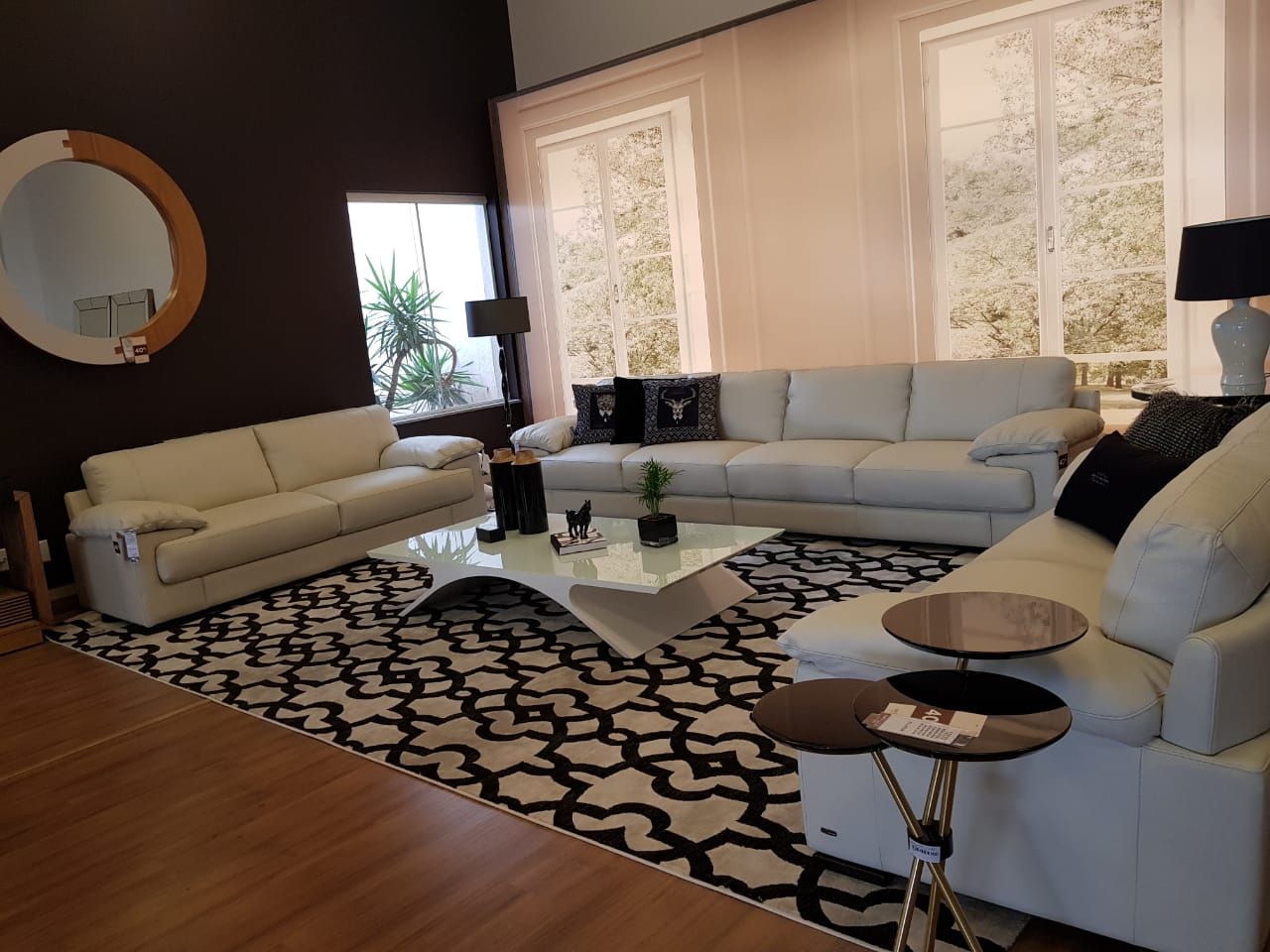 Black and cream patterned rug in a contemporary living room