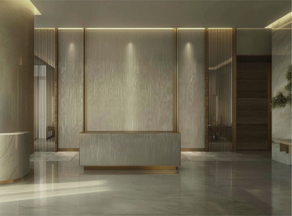 Hotel reception desk against a tall textured metal wall with brass reveals