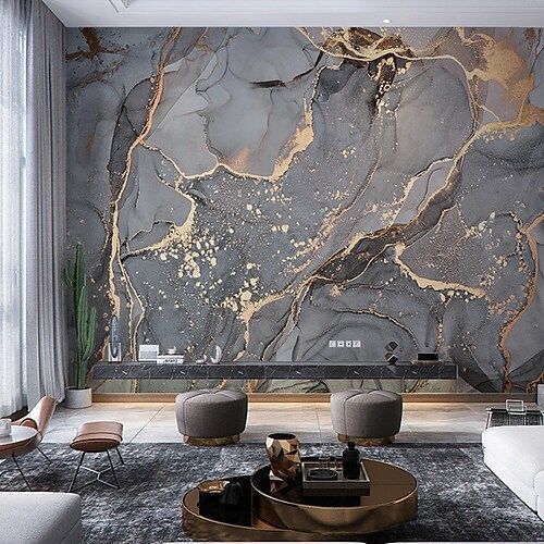 Living room with a grey and gold marble mural covering one wall