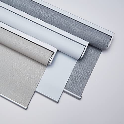 Three rolled shade fabrics in white, linen and grey