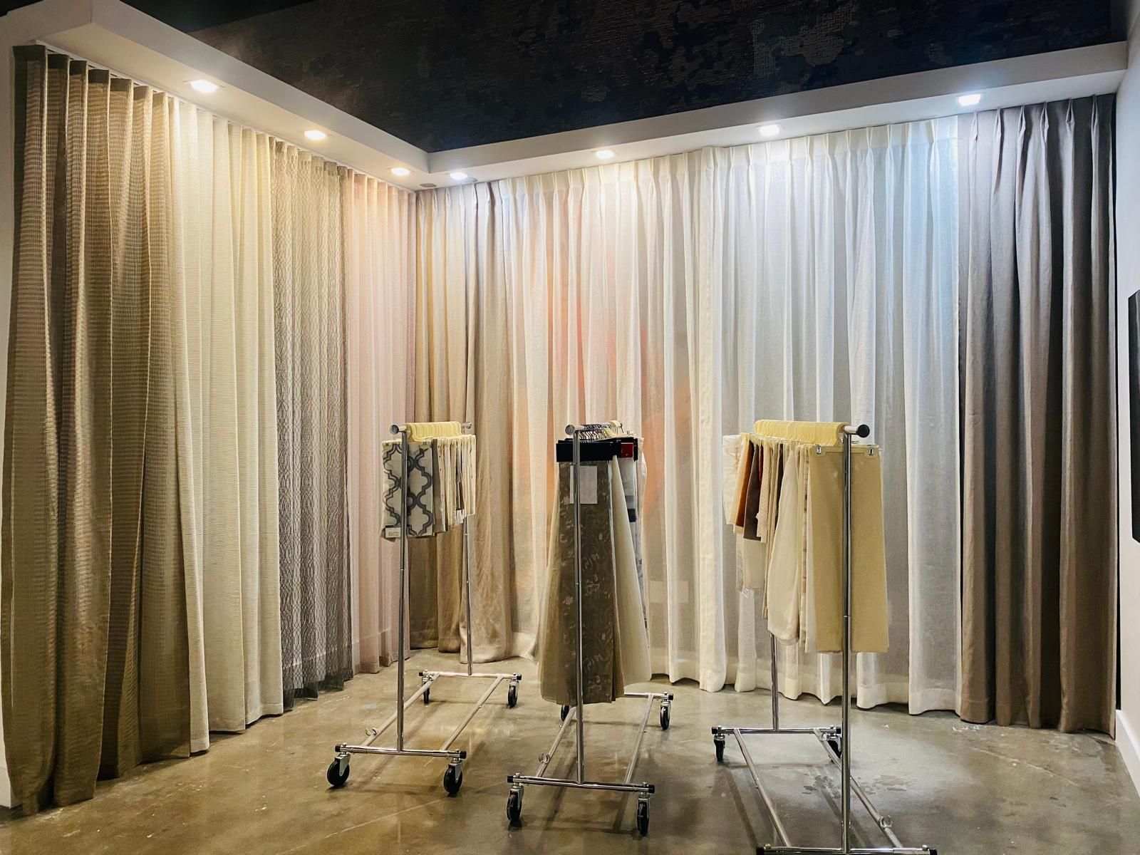 Bramstones showroom with rows of drapery and fabric samples