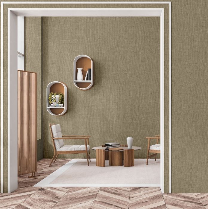 Sitting room framed by a doorway, walls in olive grasscloth