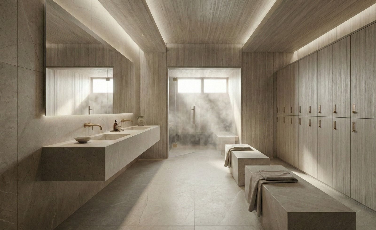 Stone changing room with benches, lockers and a steam room beyond glass