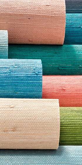 Colorful grasscloth rolls revealing thick woven natural-fiber texture