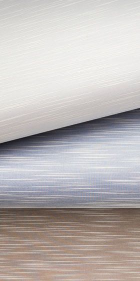 Pale silk and sateen wallcovering rolls