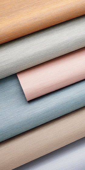 Muted rolls of striated vinyl wallcovering