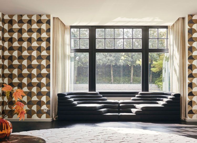 Graphic wallcovering framing a sunlit sitting room